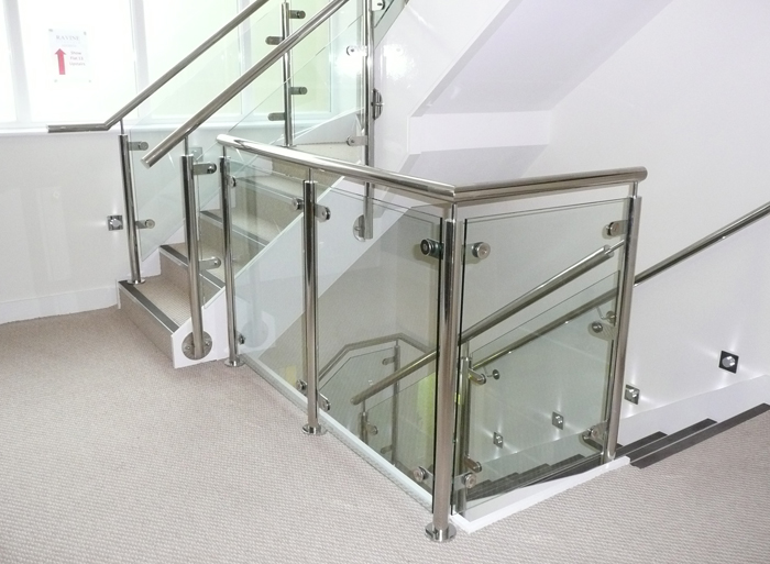 Mild steel staircase, stainless steel balustrade with glass infills for a leading options in UK.