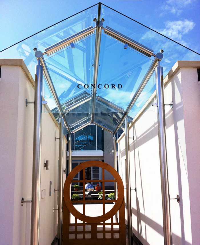 Stainless steel glass structure/ canopy / entrance for new contemporary sea front dwelling.