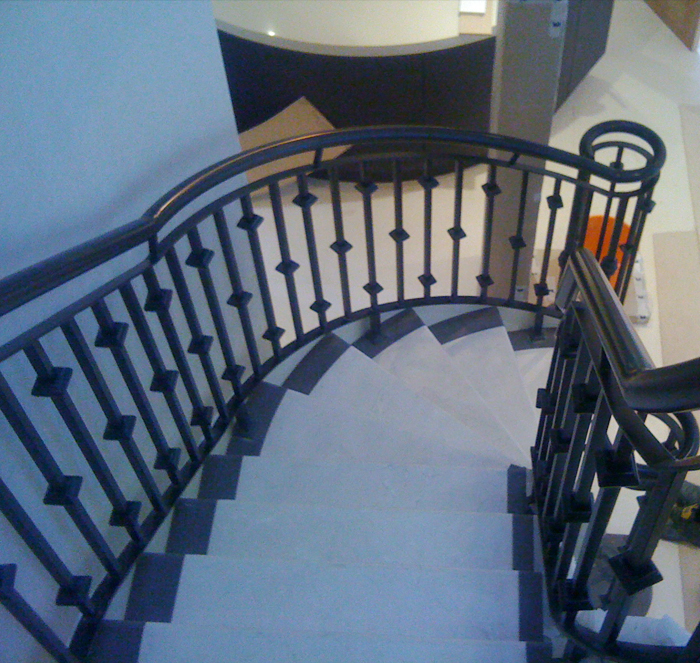 Powdercoated architectural balustrading to new mild steel helicore staircase in Sandbanks, Poole