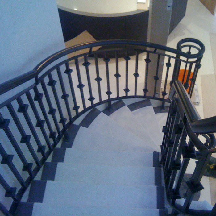 Powdercoated architectural balustrading to new mild steel helicore staircase in Sandbanks, Poole