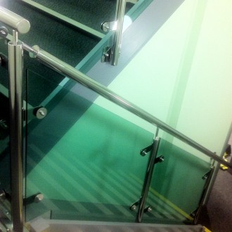 Mild steel staircase, stainless steel balustrade with glass infills for a leading options in UK.