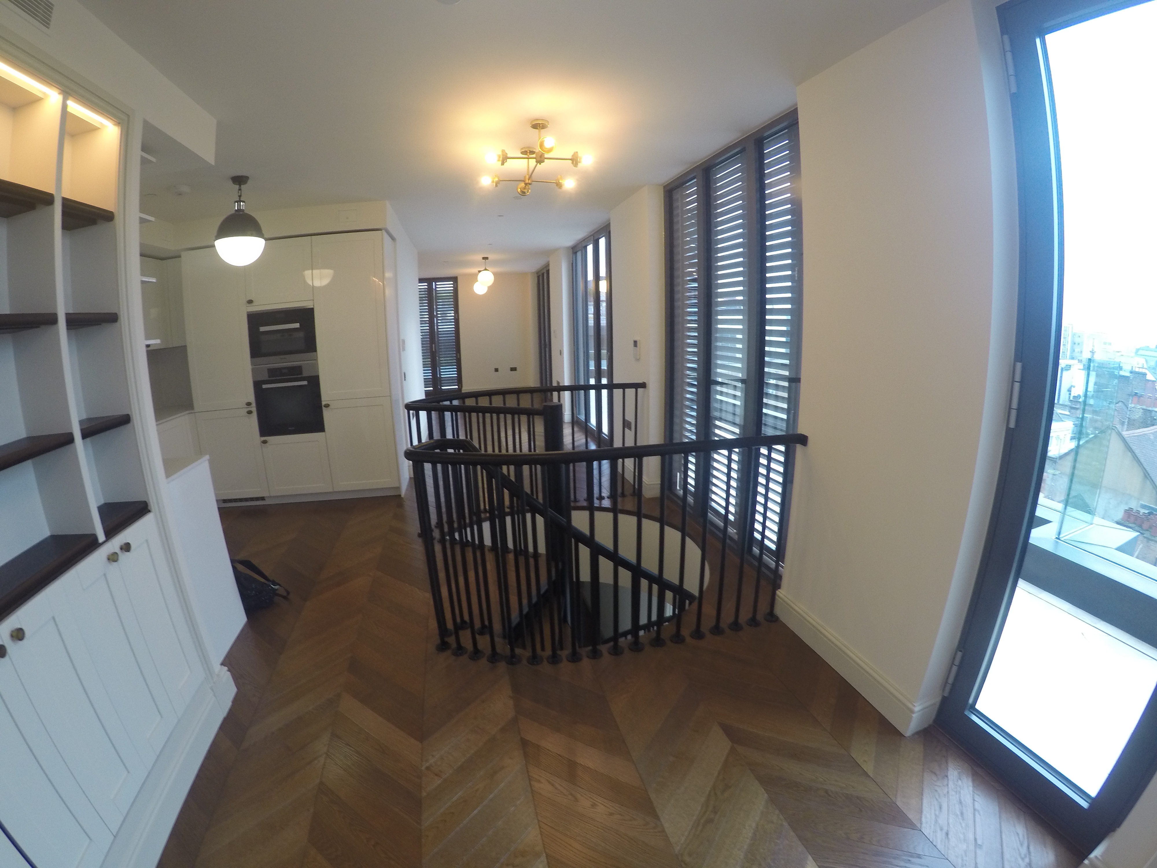 Bespoke Black Mild Steel Spiral Staircase for residential penthouse apartment in London.