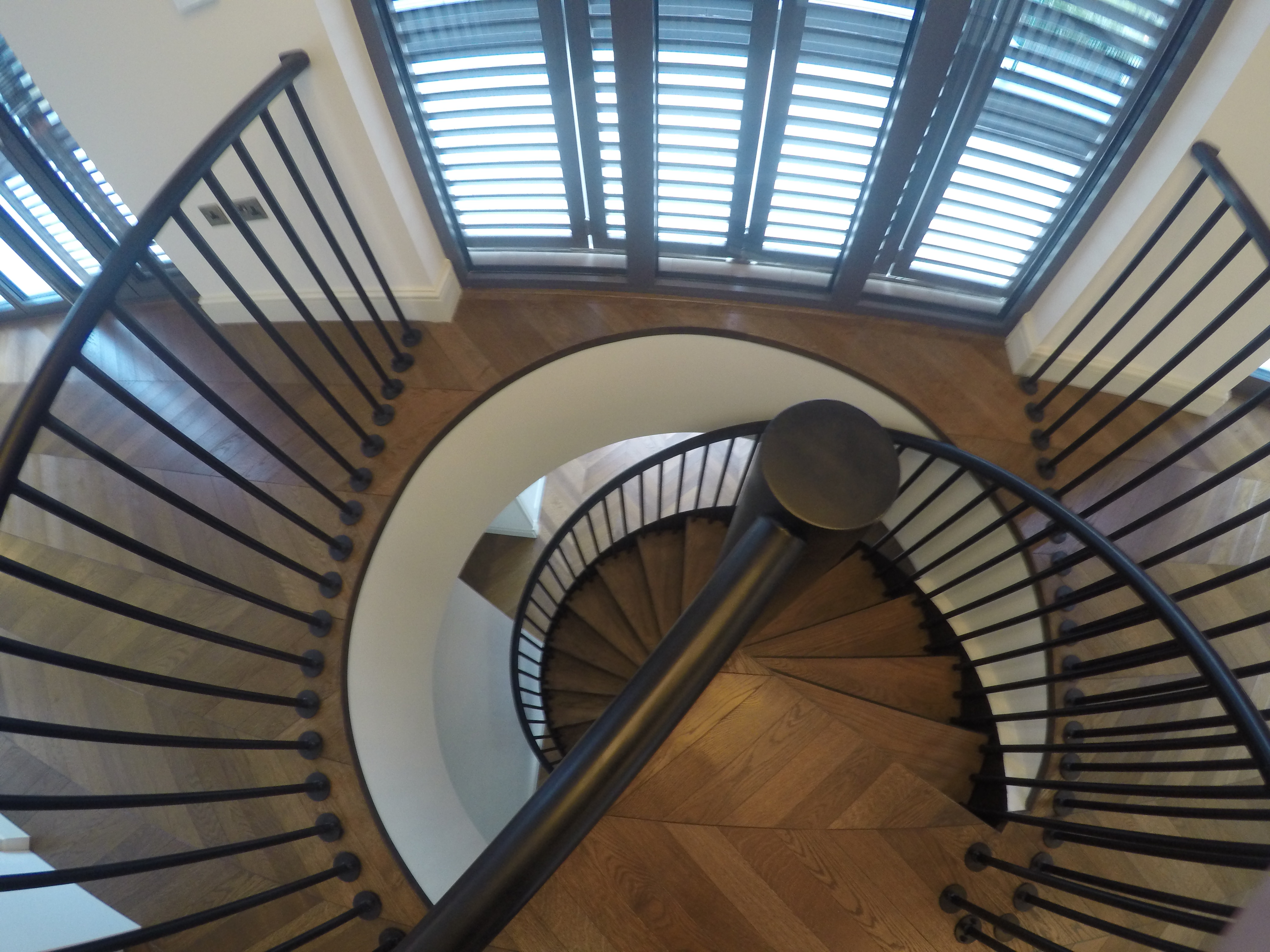 Bespoke Black Mild Steel Spiral Staircase for residential penthouse apartment in London.