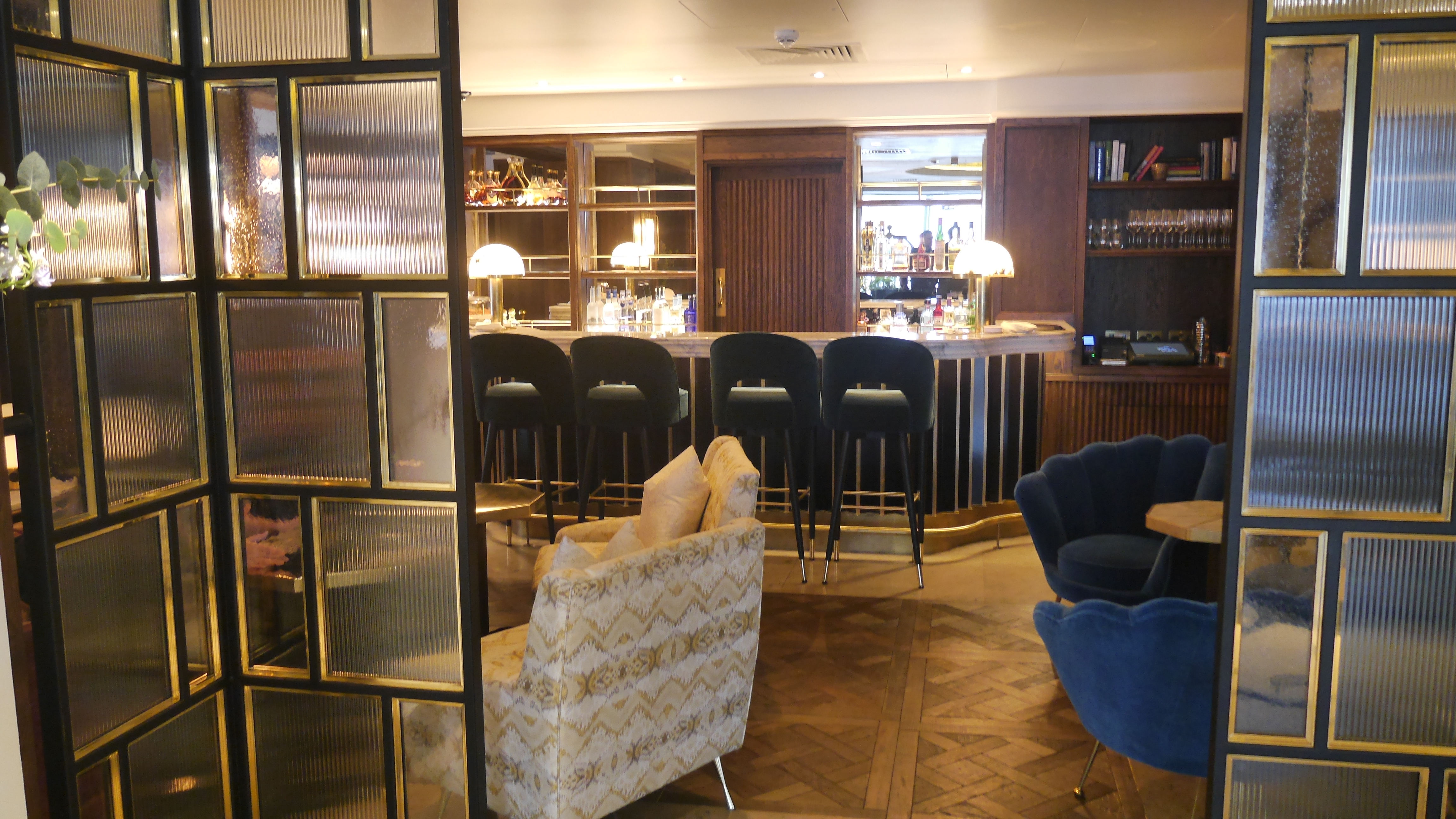 Black Mild Steel and Brass Cocktail Bar dividing screens at a Hotel in London.